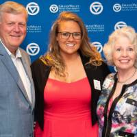 tom and marcia with woman at photo station